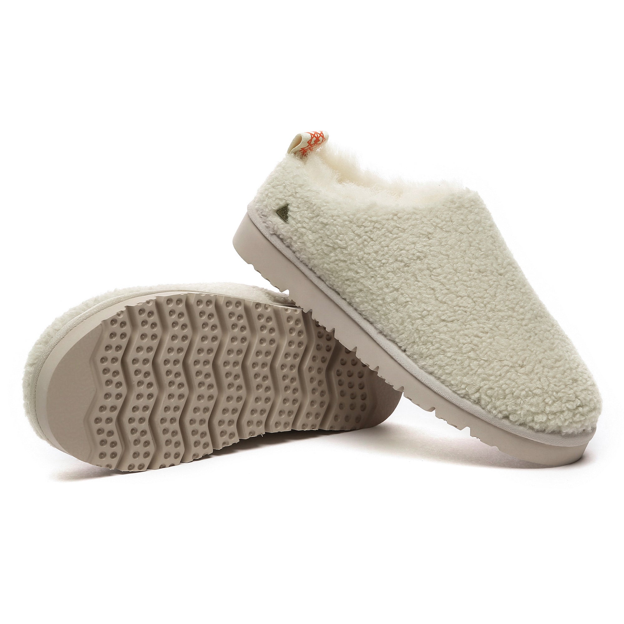 EverUgg PlushCozy UGG slippers with soft plush lining and comfortable slip-on design, shown in a cozy indoor setting.