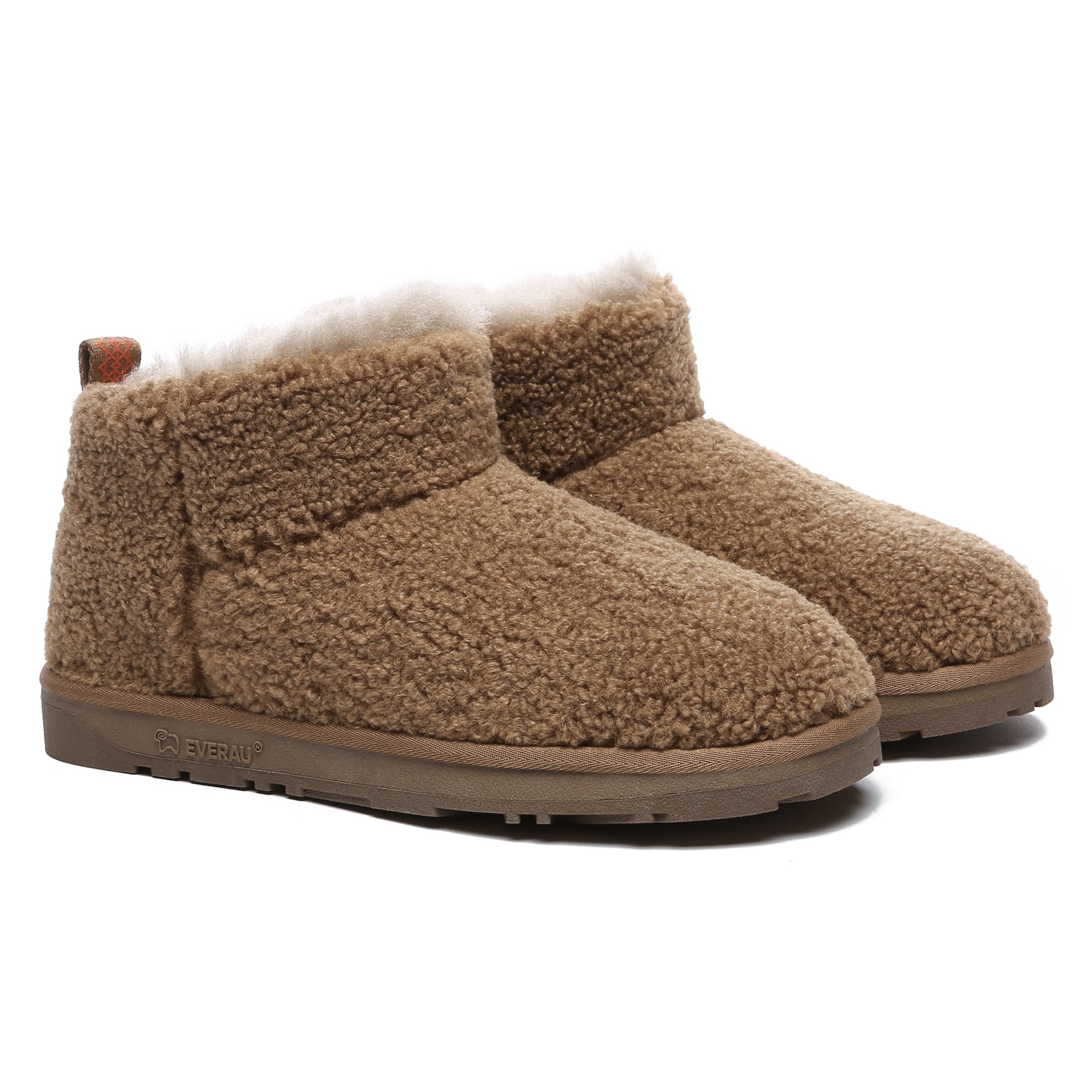 Close-up of PlushCozy Ultra Mini UGG Boots by EverUgg, showcasing soft plush exterior and mini ankle-high design.