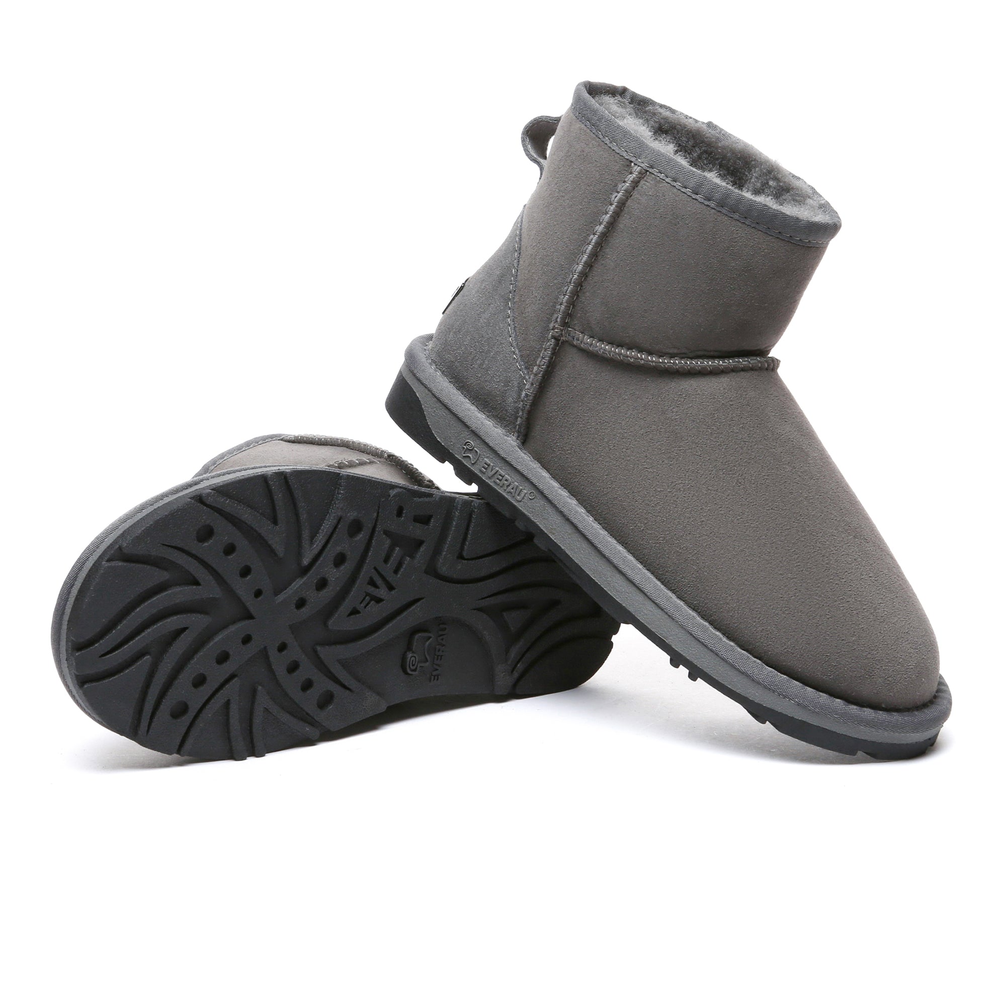 EverUgg Premium Mini Classic Sheepskin UGG Boots for women, showing the cozy, sheepskin-lined design in a natural outdoor setting.