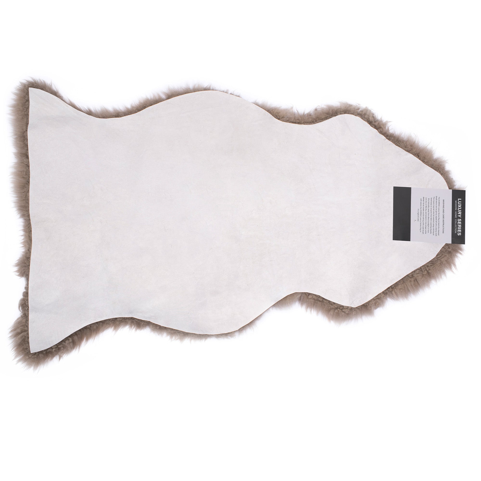 EverUgg single color wool rug with a long, plush pile, showcasing a soft, neutral-toned wool textile for cozy home decor.