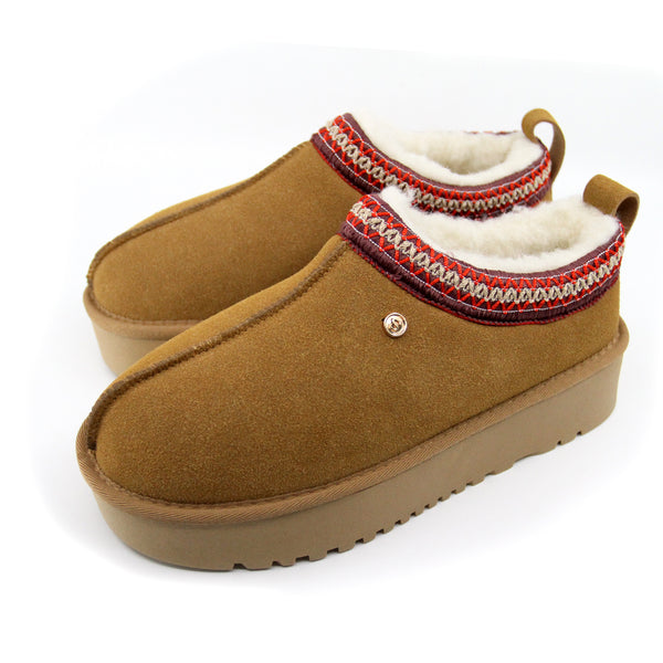 Snuggyz Alpine Platform UGG slippers for women, featuring plush fur lining and sturdy platform sole, shown from a side angle.