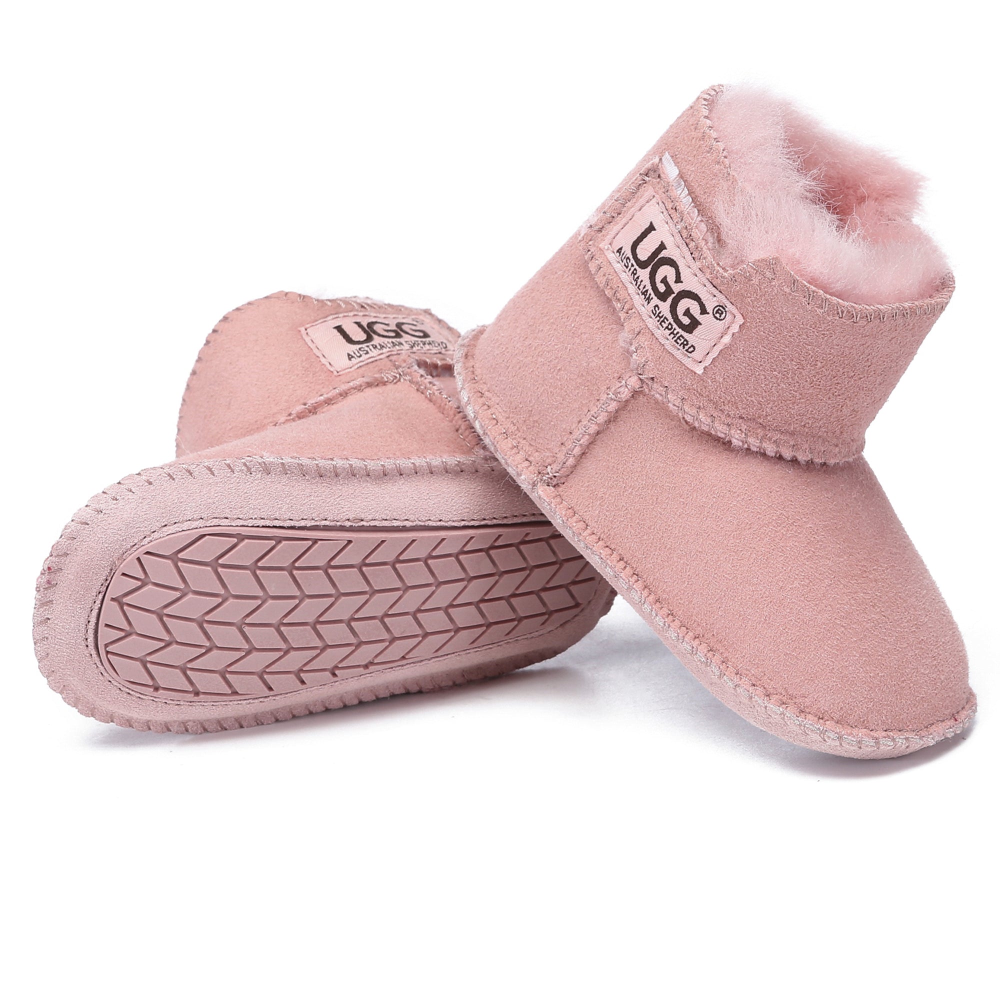 Baby UGG Eliana booties for kids by EverUgg, soft suede with cozy lining and cute bow detail on a child’s feet.