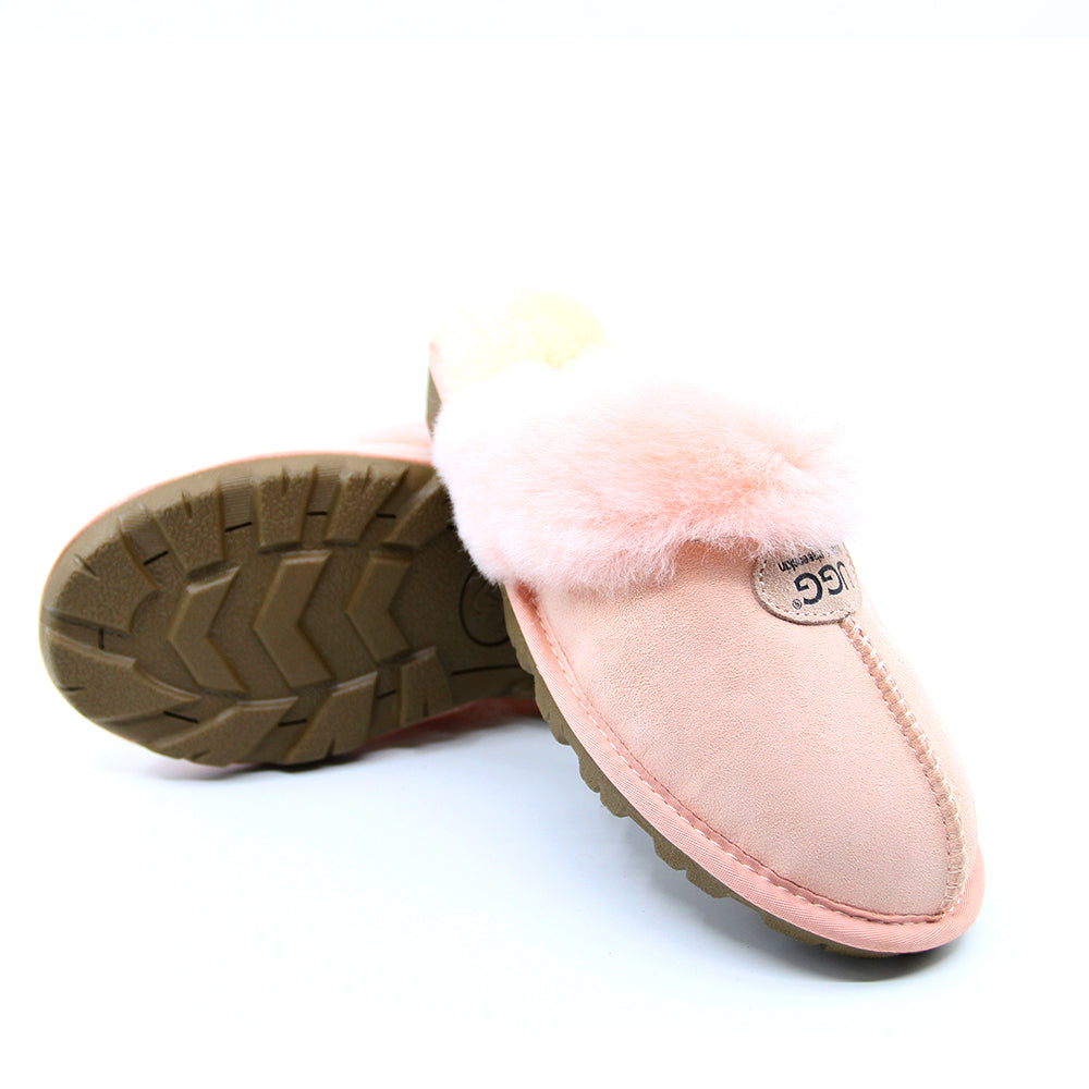 A pair of pink UGG Scuff slippers for women, featuring soft, cozy material and slip-on design perfect for indoor comfort.