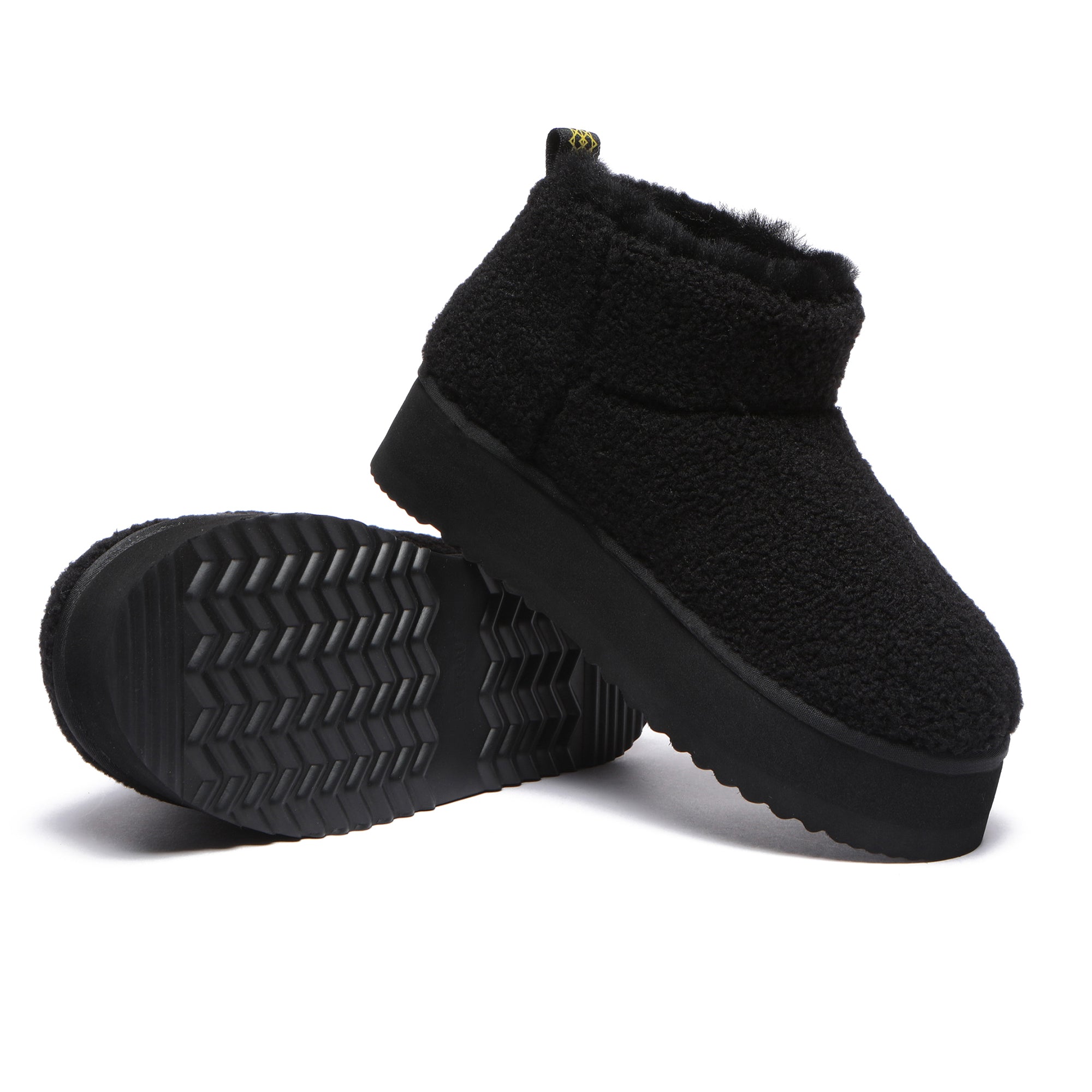 Black Ultra Mini TeddyFluff Platform UGG Boots by EverUgg featuring plush fur lining and a thick platform sole.