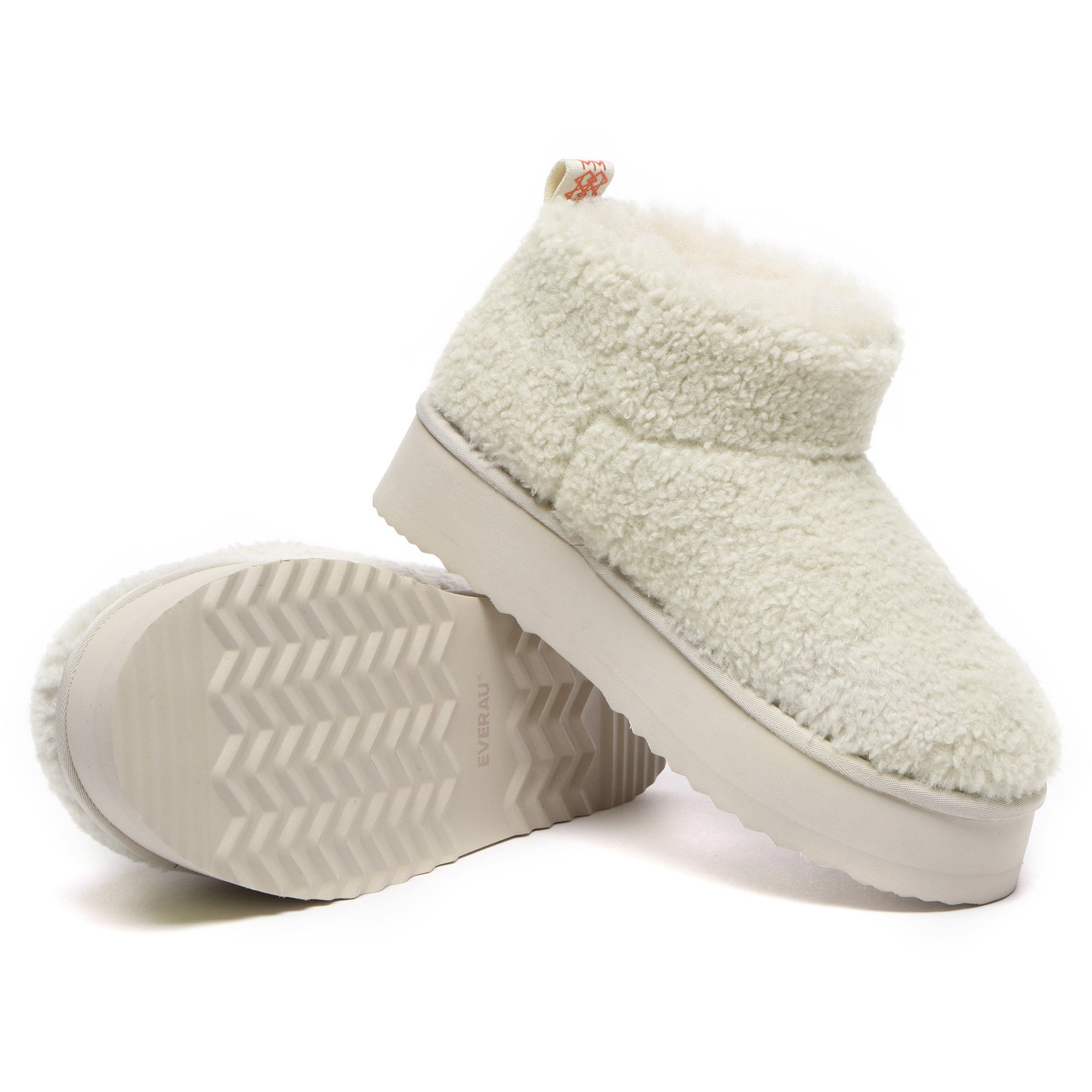 EverUgg Ultra Mini TeddyFluff platform UGG boots in sand color with plush fur lining and thick soles, displayed on a white background.