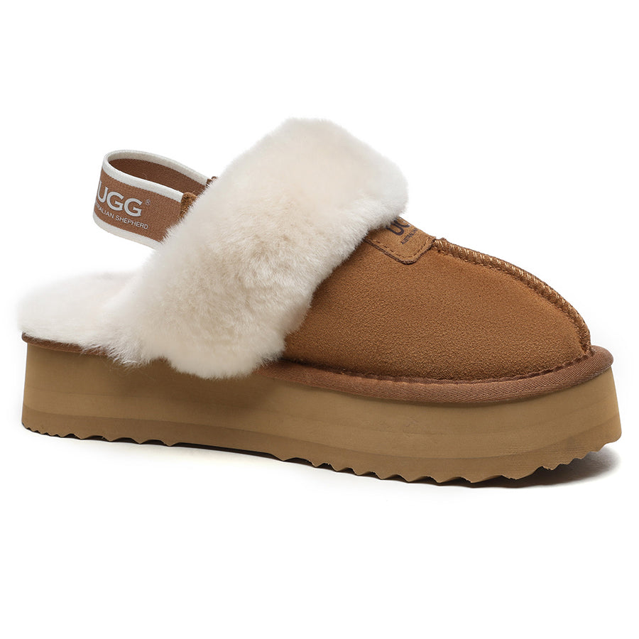 EverUgg Beta Platform UGG slippers with plush lining and chunky sole, displayed on a chest surface.