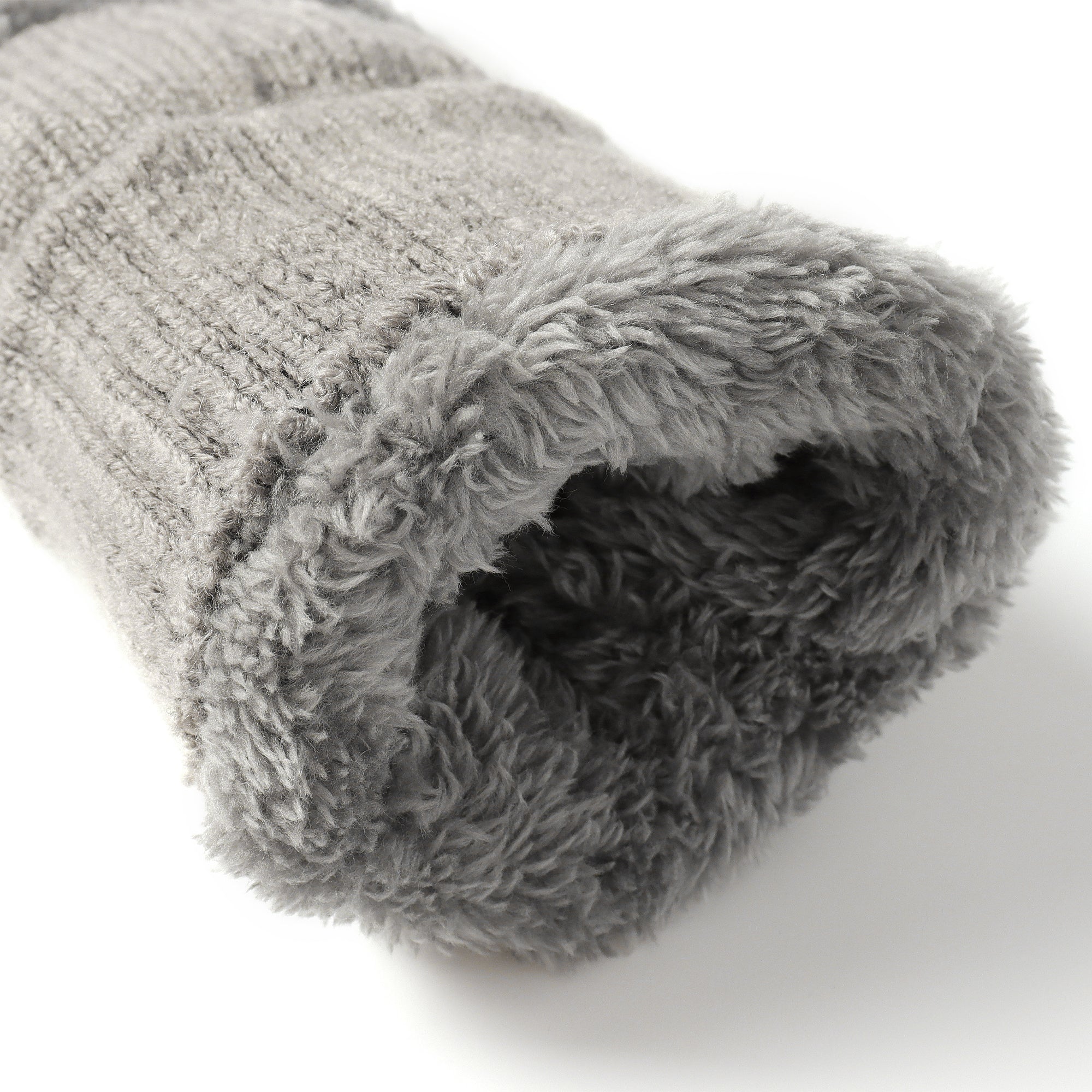 Light gray EverUgg fingerless ultra plush knit gloves shown on a model, highlighting soft, cozy fabric and stylish design.