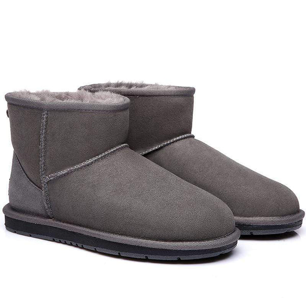 Pair of EverUgg Mini Classic UGG Boots for women with plush sheepskin lining and tan suede exterior.