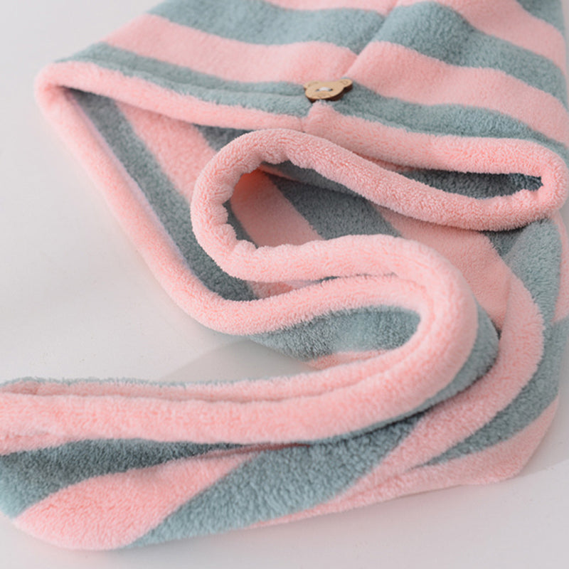 Pink and blue Snuggyz® fast drying hair towel with soft, lightweight fabric, designed for quick hair drying and comfort.