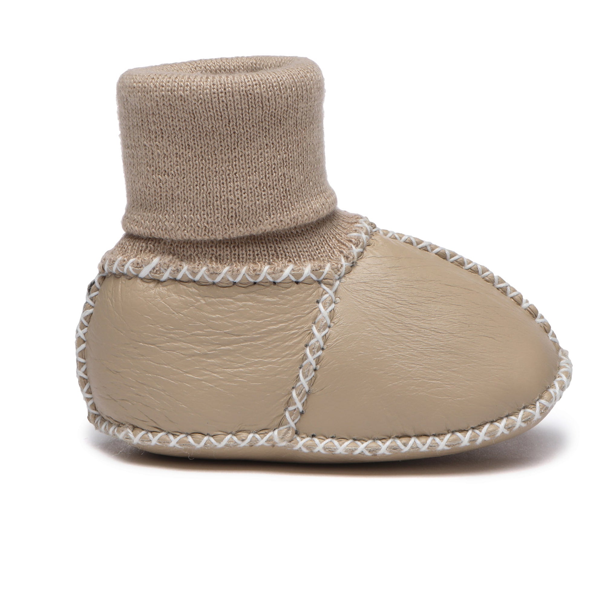 Soft EverUgg baby booties in neutral color, cozy UGG-style shoes for infants, with plush lining and slip-on design.