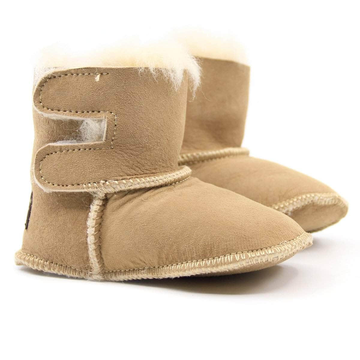 UGG Baby Boots in soft suede with plush lining, designed for infants and toddlers, featuring the UGG logo on the side.