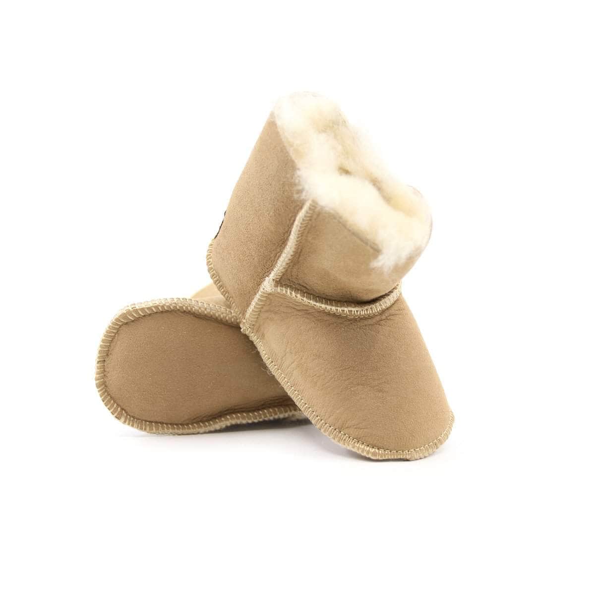 UGG baby boots in soft, tan sheepskin with plush lining, designed for infants and toddlers, from UGG Direct NY.