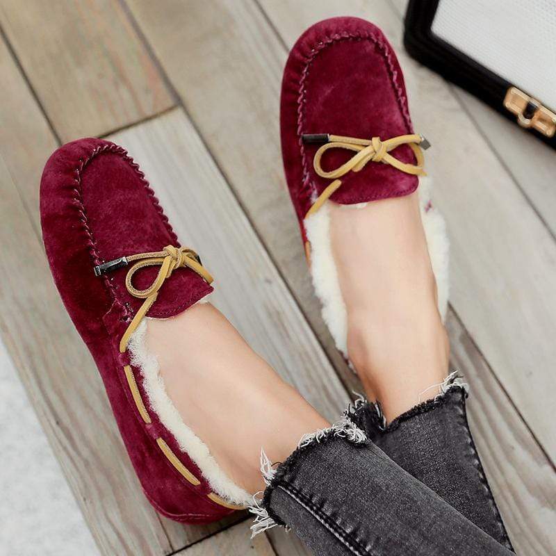 AuSnow UGG Ozsnow Premium Moccasin women’s slippers with soft suede exterior and cozy interior for comfortable indoor wear.