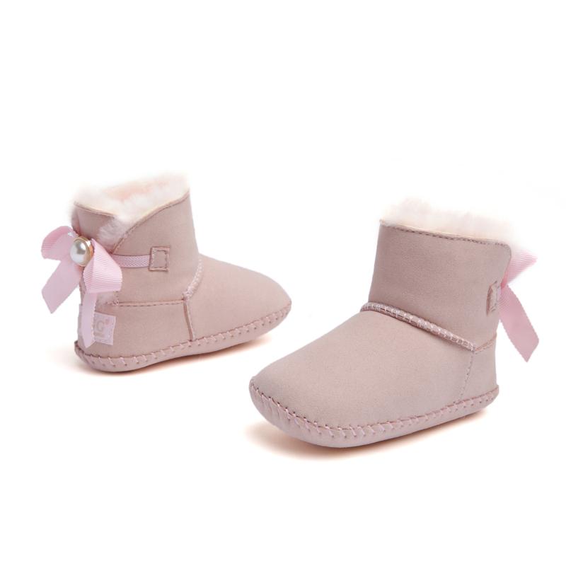DK UGG stylish baby boots for kids, pink and cozy shoes with fur lining, ideal for fashionable little ones.