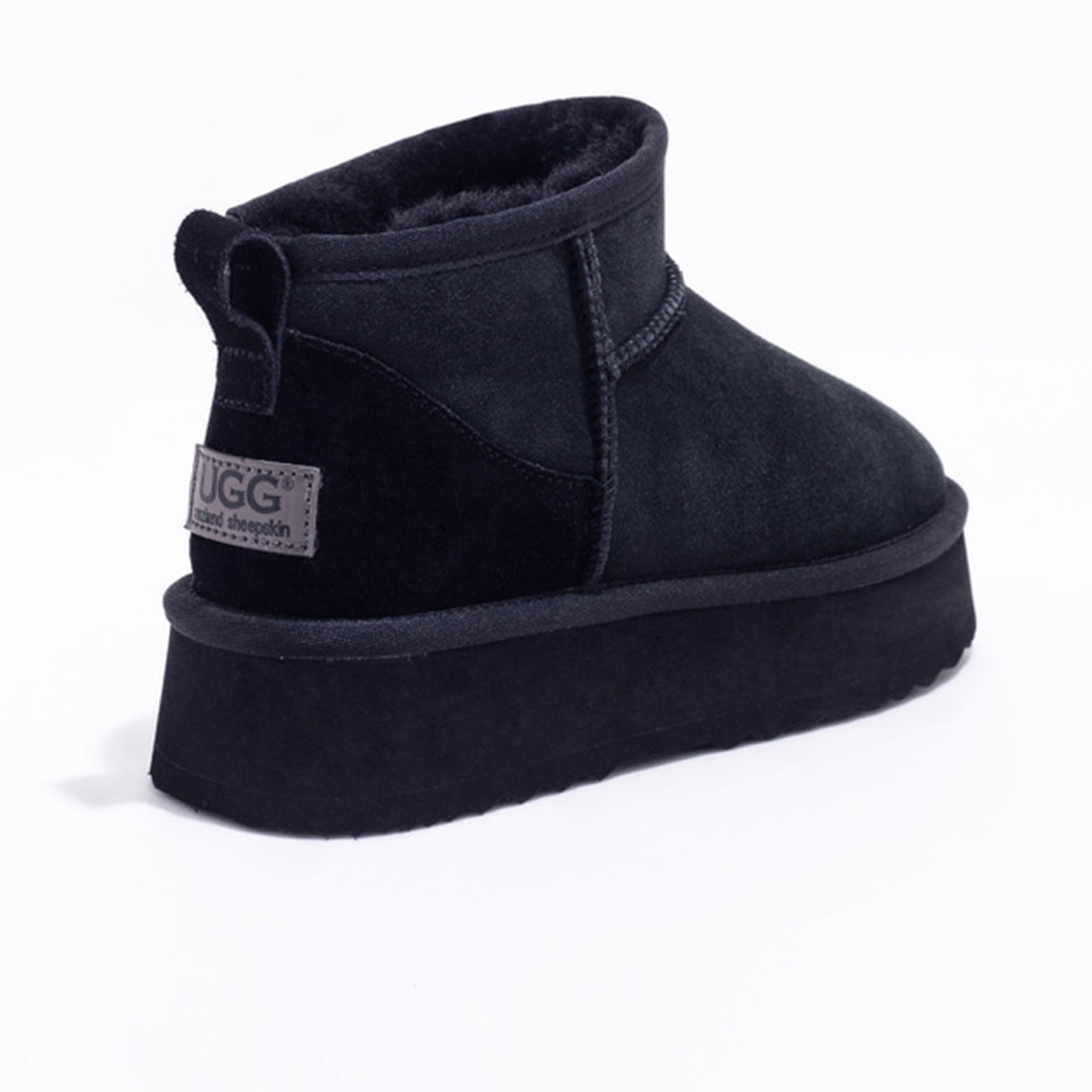 Black Auzland Ultra Mini Platform UGG Boots with a sleek design and cozy fur lining, perfect for stylish winter wear.
